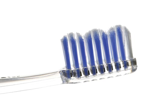 Clear toothbrush isolated on white background closeup