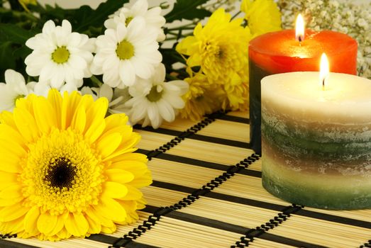 romantic relaxing scene with flowers and burning candles