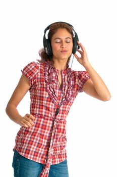 Pretty girl listening to her mp3 player on headphones. Isolated on white background with room for text