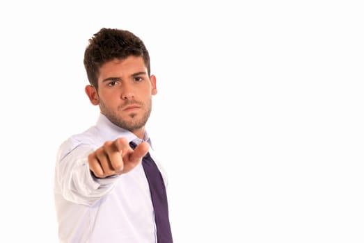 young businessman pointing to camera with copy-space isolated on white background