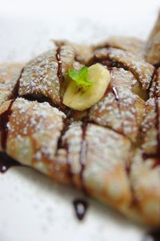 Banana and Chocolate Crepe. High Key shot with shallow depth of field