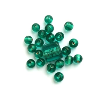 Sea green beads on white background