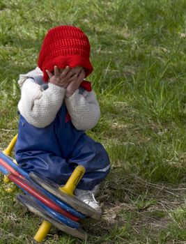 Sweet little toddler crying over a broken bike