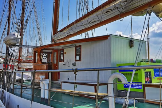 Sailboats, ships in port on the dock