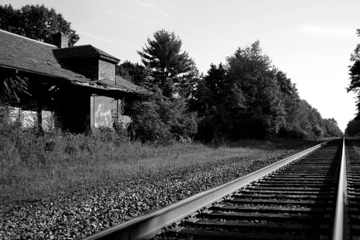 A Abandoned train station and railroad tracks