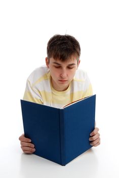 A boy reading a book, textbook, studying, learning or recreational.  White background.