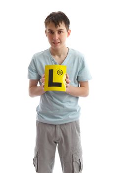 Teenage boy holding L plates (or other sign).  White background.