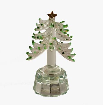 Little plastic Christmas tree for decoration over white background