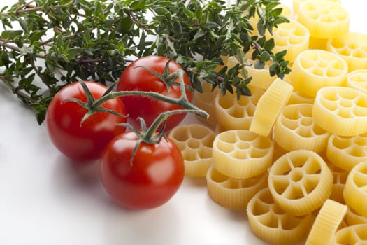 Dried rotelle pasta, cherry tomatoes and thyme.