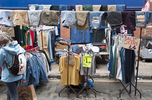 LONDON - OCTOBER 17: Clothing stall in Bricklane market, which takes place every Sunday. October 17, 2010 in London, England.
