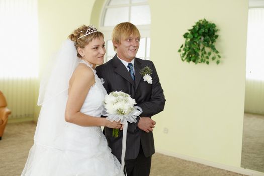 Young bride and groom in a solemn moment