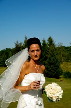 Bride in white dress with flower bouquet