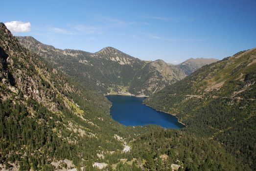 The oredon Lake seen from Cap-de-Long  in French Hautes-Pyrenees is in the chain of hydroelectric energy stations. the lake has also a dum seen at the and of the lake surrounded mountains of pyrenees nation park