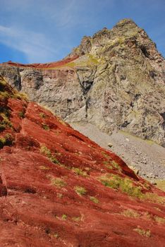 Red rock mountains are surrounding Anayet peak 2545 m in Spanich Aragon Pyrenees just in the border of French Atlantic Pyrenees, its a famous geological fenomenon of iron minerals at surface 