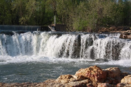 The grand fall with rushing water on to rocks