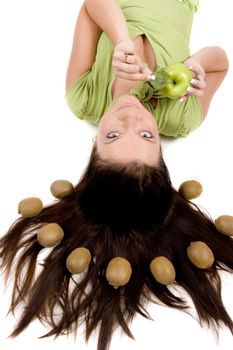 Young girl with fruits on white background