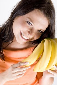 Young girl with fruits on white background