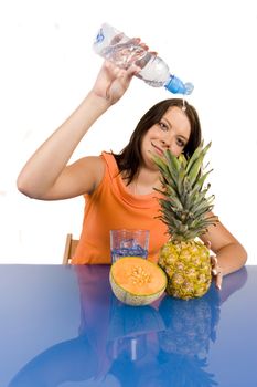 Young girl with fruits on white background