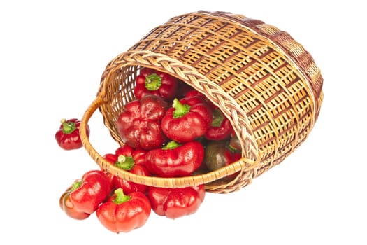 Red pepper in basket on white background