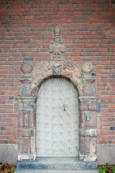 a old and  weathered door at the outside of the swedish city hall