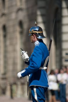 the guards are changing daily in front of the royal palace in stockholm. many tourists attend to this ceremony