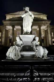 A night view of the Konzerthaus and the statue of German poet Friedrich Schiller in Berlin.