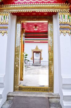 Beautifully decorated doorway entrance to buddhist temple in Thailand
