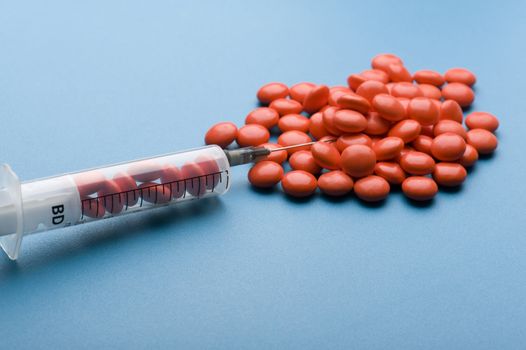 object on blue - medical Tablet and syringe