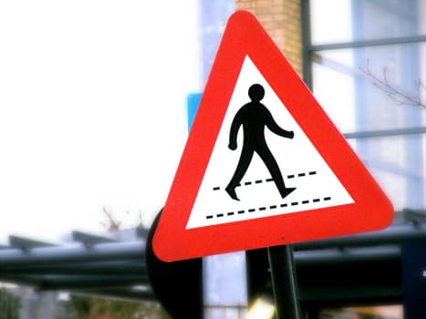 A photograph of a road crossing sign.