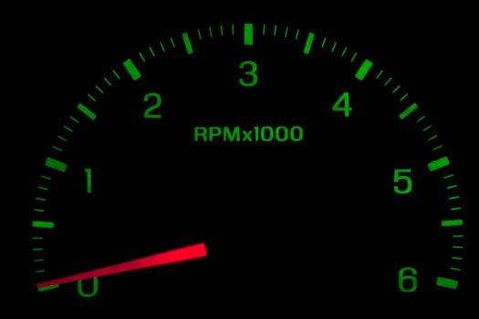 green speedometer on black background