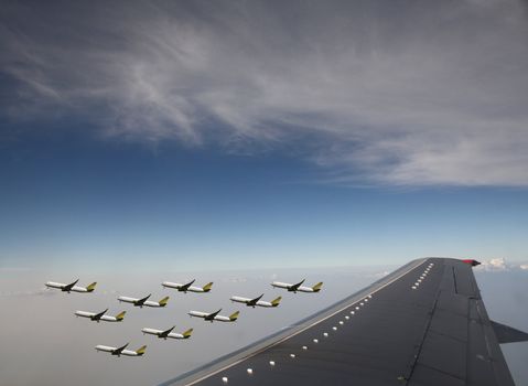 Aircraft in flight over the blue clouds 