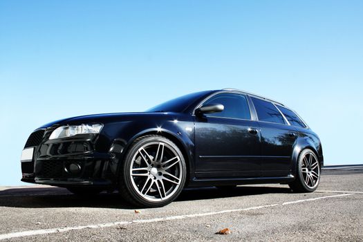 Black Sports Car on a colorful background