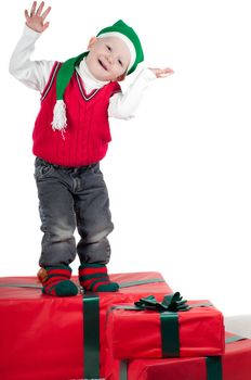 Shot of christmas toddler with presents isolated on white