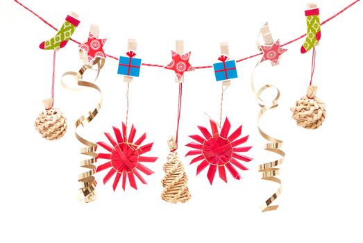 Hanging Christmas decorations on a white background