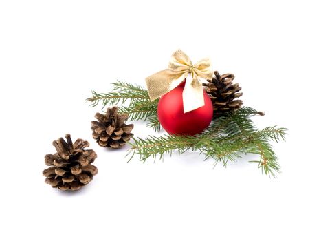 Three cones and red glass ball on white background