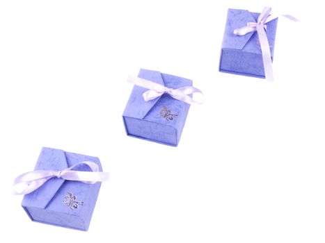Three small lilac giftboxes isolated on white background