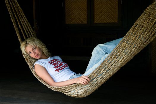 The beauty shakes in a hammock. Tropics.