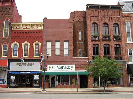 A photograph of commercial buildings in a town.