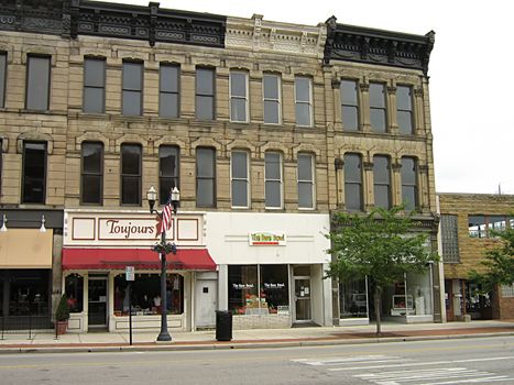 A photograph of commercial buildings in a town.