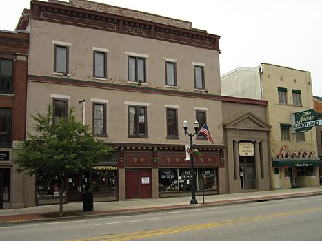 A photograph of commercial buildings in a town.