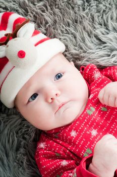 Shot of little cute baby in red