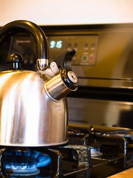 Tea pot on gas stove.