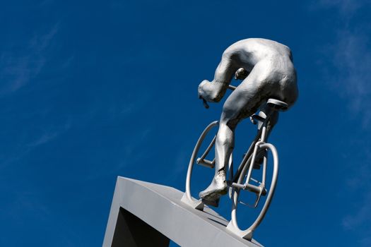 Cycling in the ascent of a hill, part sculpture