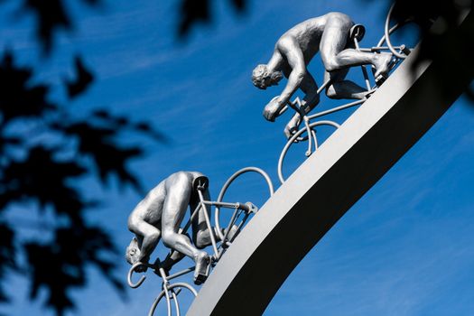 Two riders on the descent of a hill, sculpture
