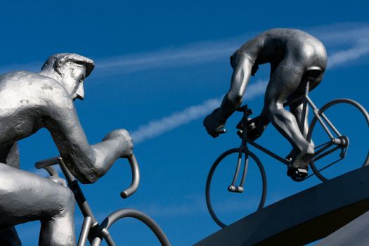 Two cyclists on the rise, detail of sculpture