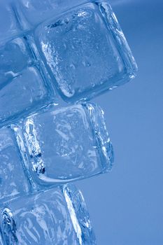 Ice cubes on blue background