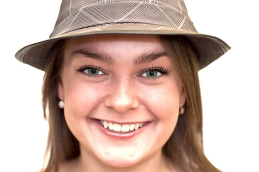 Beautiful young woman with green eyes wearing a hat. Close-up, portrait. Isolated on a white background.