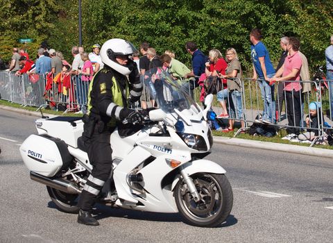 COPENHAGEN - SEPTEMBER 25: Unknown danish policeman secures the  2011 UCI road race championships in Rudersdal. The event starts on September 19 - 25, 2011 in Copenhagen and Rudersdal, Denmark.   