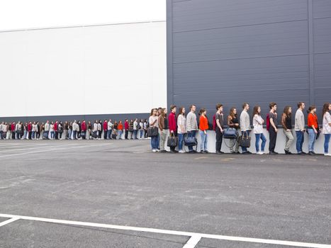 Large group of people waiting in line