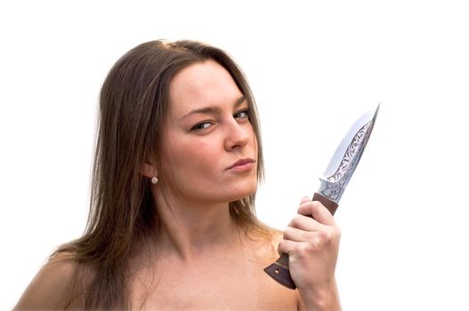 Young woman with a hunting knife in his hand. Studio shot on white background.